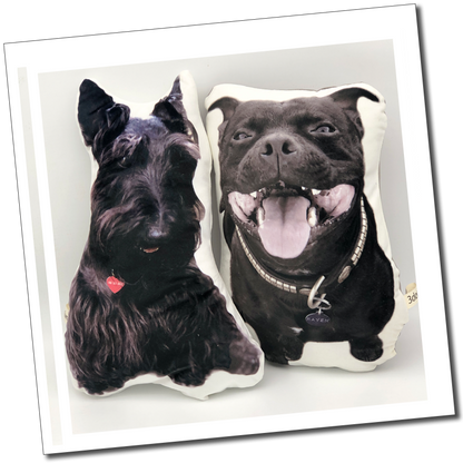 Two black dog cushions: “Two personalised cut-out pet cushions featuring a black Scottish terrier and a smiling short-haired black dog.”